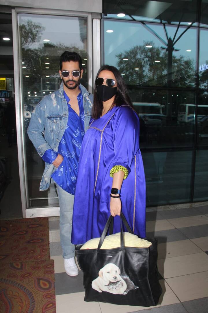Neha and Angad looked excited as they arrived in twinning avatar at the airport to attend Vicky and Katrina's wedding festivities in Rajasthan.