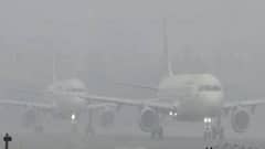 Airport Fog: কুয়াশায় কমেছে দৃশ্যমানতা, কলকাতা থেকে দেরিতে উড়ল বেশ কয়েকটি বিমান| Bangla News
