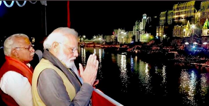 Prime Minister Narendra Modi with Haryana Chief Minister Manohar Lal Khattar watch the Ganga Aarti from a ship, at Ganga Ghat in Varanasi. (PTI Photo)