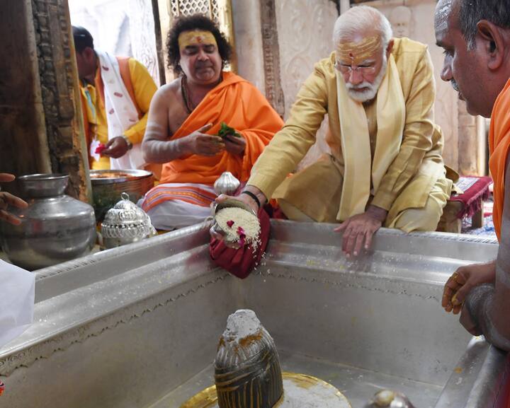 PM Modi offered prayers Kashi Vishwanath Dham temple and planted a Rudraksha tree at the premises of the temple. (PTI Photo)