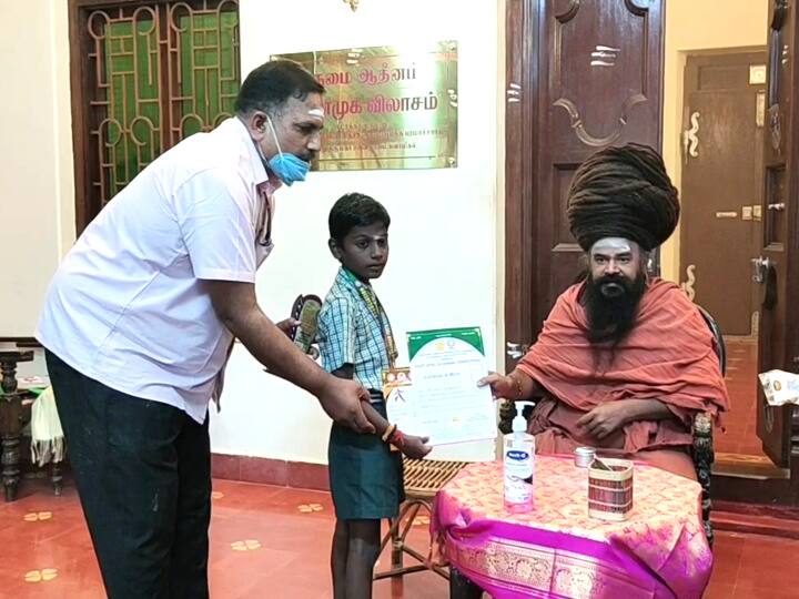 5th grade student who won the state level silambam competition Adventure around the silambam in front of fellow students சிலம்பத்தில் சாதித்த 5 ம் வகுப்பு மாணவனுக்கு தருமபுரம் ஆதீனம் பாராட்டு!