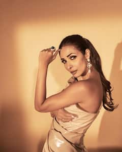 PICS | Malaika Arora’s Sultry Look In Nude Bodycon Thigh-High Slit Dress