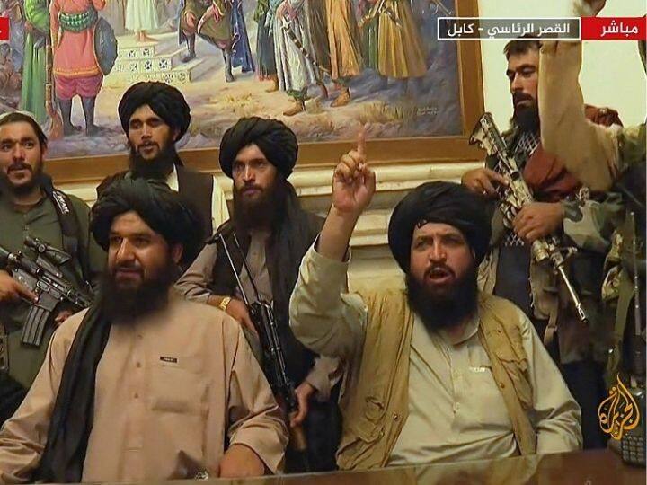 An image grab taken from Qatar-based Al-Jazeera television on August 16, 2021, shows Members of Taliban taking control of the presidential palace in Kabul after Afghanistan's president Ashraf Ghani flew out of the country. Taliban forces patrolled Kabul after a swift end to Afghanistan's 20-year war, as thousands rushed to the city's airport trying to flee the group's feared hardline brand of Islamist rule | Photo: AFP