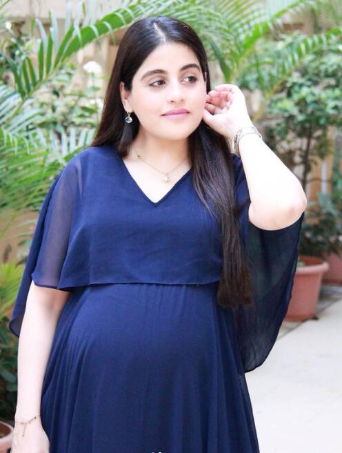 Sneha opted for a beautiful maternity gown flaunting her growing baby bump.