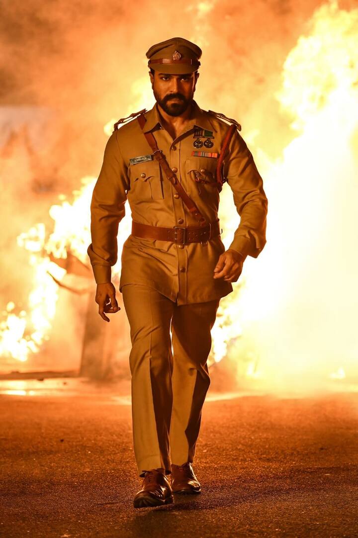 ఇందులో రామ్ చరణ్ ఖాకీ గెటప్ లో కనిపించి అలరించారు. (Photo Courtesy: RRR Twitter)