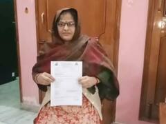 Aligarh News: अलीगढ़ में कोरोना से मौत के मुआवजे में घोटाला? जीवित महिला के बेटे से कहा- सिग्नेचर करके आधे पैसे ले जाओ