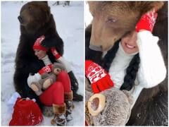 Watch: खतरनाक भालू के साथ खेलती दिखी महिला, देखकर आप भी रह जाएंगे दंग