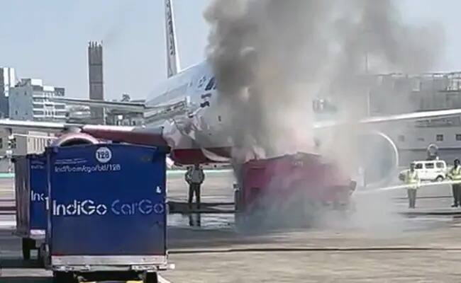 Watch: Tow Vehicle Bursts Into Flames Near Air India Plane At Mumbai Airport Watch: Tow Vehicle Bursts Into Flames Near Air India Plane At Mumbai Airport