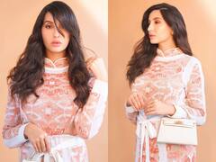 Nora Fatehi Photos: नशीली आंखें, चेहरे पर जुल्फें बिखेर, ऑरेंज-व्हाइट ड्रेस में परी-सा लुक लेकर कहां चल दीं नोरा फतेही !