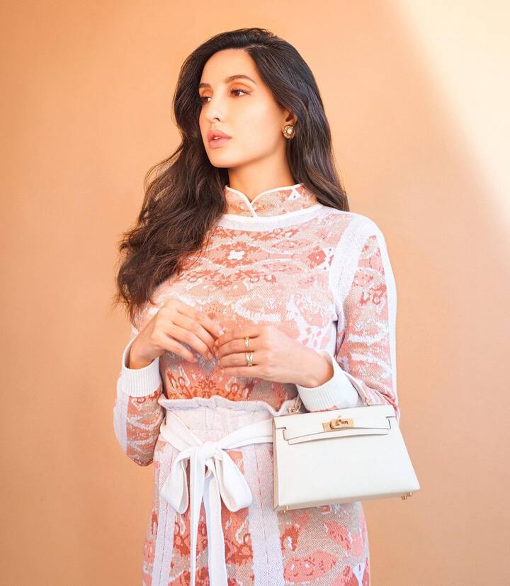 The actress completed her look with a white purse and white pumps. Nora has recently been making everyone groove to the beats of her latest song ‘Dance Meri Rani’ sung by Guru Randhawa. All Image Courtesy: @norafatehi/Instagram.