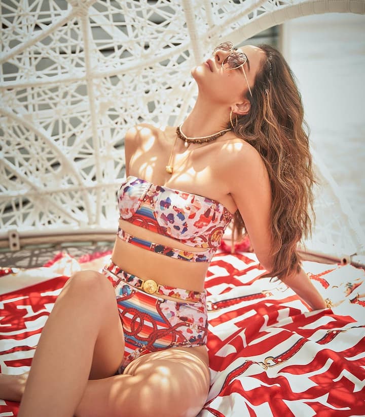 The actress wore a cutout bikini by designers Falguni and Shane Peacock for her photoshoot. The diva is raising oomph in the pictures.