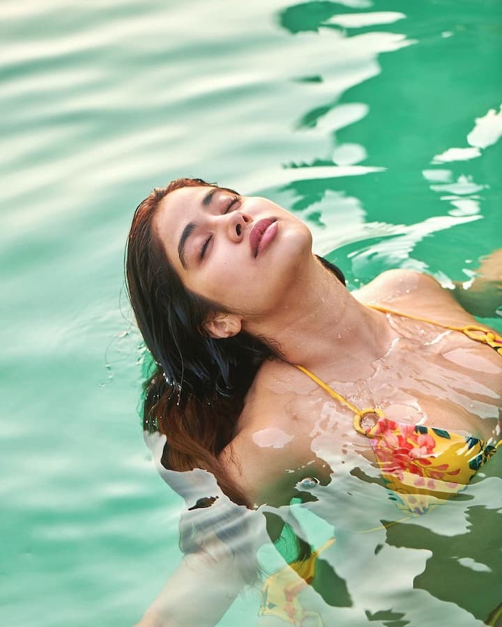 Janhvi Kapoor channeled her inner mermaid as she posted a couple of pictures of herself in yellow printed bikini.