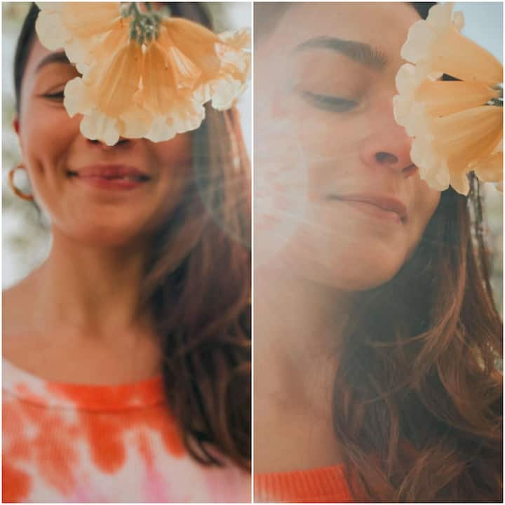 Bollywood actress Alia Bhatt looks as fresh as a daisy in the recent pictures that she dropped on the photo-blogging site Instagram. Posing with a flower hanging from its bud, she looks gorgeous as ever.