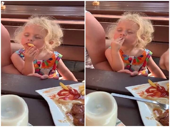 baby girl sleeping while eating french fries falls badly watch cute baby funny video goes viral on instagram Watch: फ्रेंच फ्राइज खाते-खाते इस बच्ची को आई नींद की झपकी, फिर हुआ कुछ ऐसा कि जमकर वायरल हो रहा वीडियो