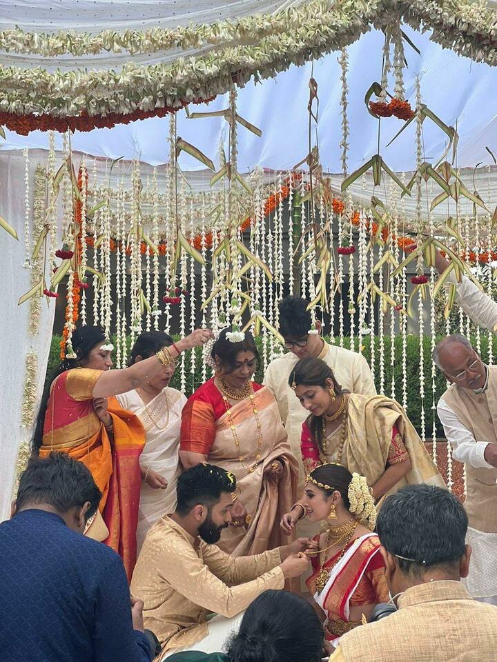 Mouni-Suraj performing rituals at their wedding.