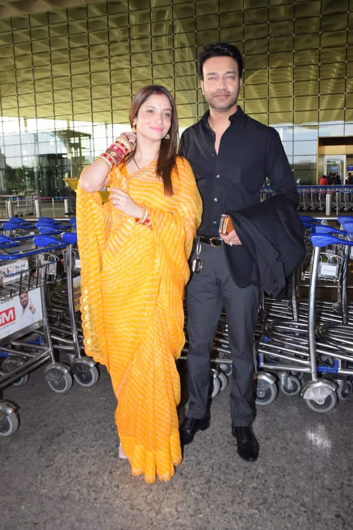 Ankita ditched the stylish airport look and went ahead with the ethnic look. She opted for a bandhej print orange saree. She accessorised her look with bright red bangles.