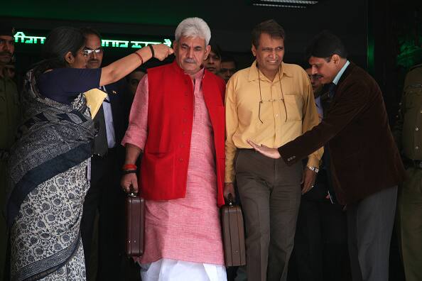 Union Railway Minister, Suresh Prabhu(R) along with Minister Of States(MOS) for railways on his way to Indian Parliament to present Union Railway Budget 2015. The Union Cabinet cleared the merger of the Railway and Union Budget from 2017-18 onward. | Source: Getty
