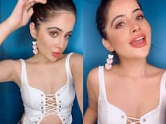 Urfi javed Photos: व्हाइट क्रिस क्रॉस टॉप में उर्फी जावेद ने दिए पोज, फैंस बोले- मैडम यूं ही रोज तस्वीरें डालते रहिए