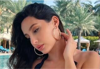 Nora Fatehi shares her picture in black swimsuit on Instagram photo goes viral பிகினி உடையில் நோரா ஃபதேஹி.. பற்றி எரியும் இணையம்.. வைரலாகும் படம்!