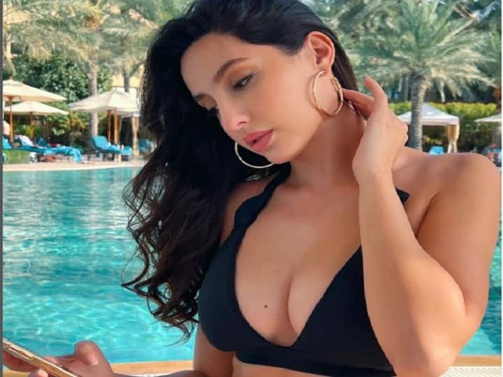 Nora Fatehi Flaunts Her Body in Black Bikini Actress Looking Fire Have look पूल किनारे बिकिनी में इस ख़ास चीज़ की प्लानिंग कर रही हैं Nora Fatehi, कैप्शन में छुपा है राज़!