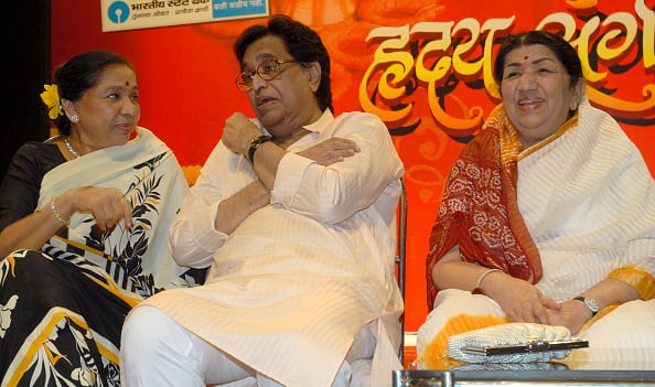 The Mangeshkars: Asha Bhosle (L) and Lata Mangeshkar attend the Hridaynath Mangeshkar's (C) 72nd birthday celebration on October 26,2008 in Mumbai, India (Getty Images)