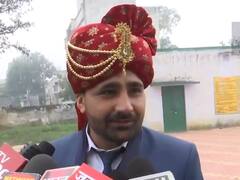 Watch: यूपी में बारात से पहले सेहरा लगाकर वोट डालने पहुंचा दूल्हा, बोला- पहले मतदान फिर बहू, वीडियो हो रहा वायरल  