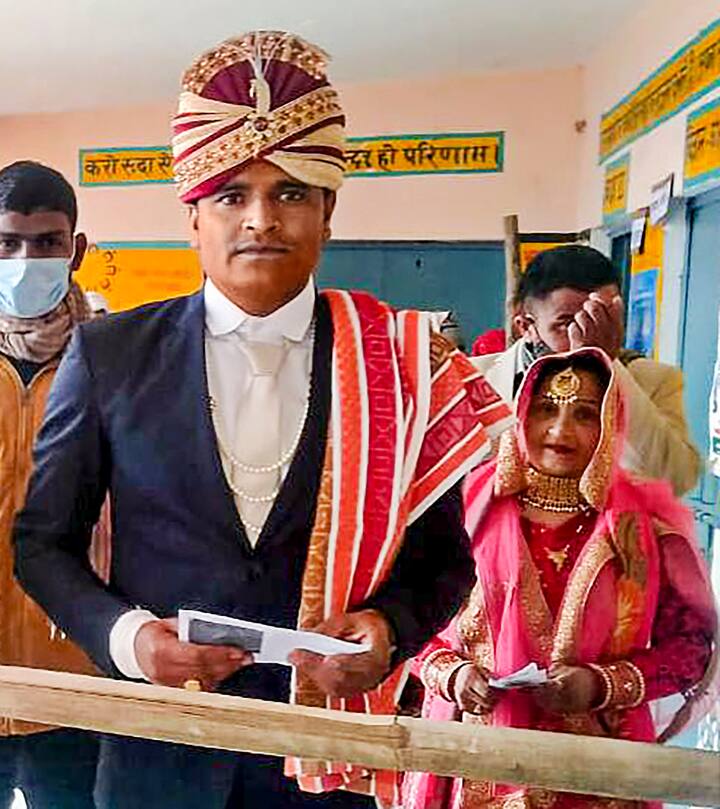 A newly wed couple comes to cast their vote. Polling for 58 constituencies of Uttar Pradesh is underway | Courtesy: PTI