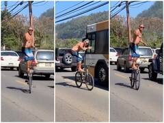 Watch: गाड़ियों से भरी सड़क पर साइकिल पर खड़ा होकर स्टंट करने लगा शख्स, देखने वालों के छूटे पसीने