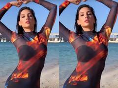 समुद्र किनारे मछली की तरह मचलती नजर आईं Nora Fatehi, वीडियो देख आप भी हो जाएंगे इनकी अदाओं पर फिदा