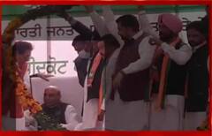 ਹਾਰ ਪਹਿਨਾਉਣ ਸਮੇਂ ਕੁਰਸੀ 'ਤੇ ਡਿੱਗੇ ਰਾਜਨਾਥ ਸਿੰਘ, ਹੀਂ ਪਵਾਇਆ BJP ਵਰਕਰਾਂ ਤੋਂ ਹਾਰ