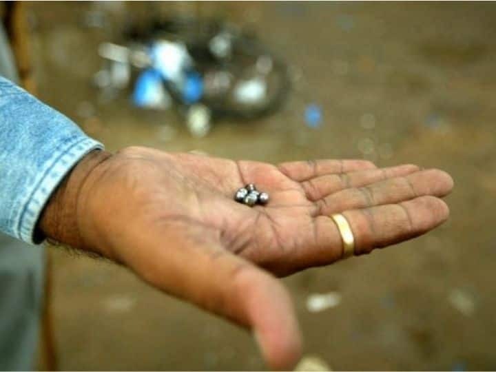 Similar to the Jaipur bombings that occurred on May 13, 2008, the bombs were planted in Tiffin carriers on bicycles. In this image, a police-man holds out ball-bearings at the site of a blast at Naroda Bazar in Ahmedabad on July 26, 2008. | Photo: AFP