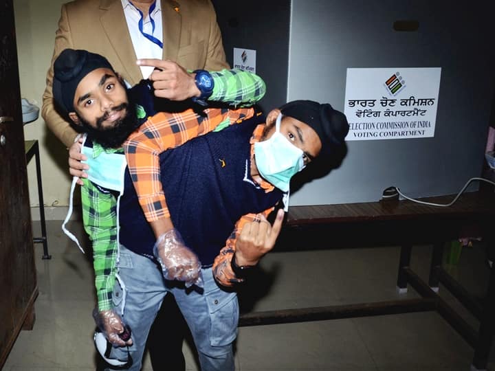 Conjoined twins Sohna and Mohna after casting their votes for Punjab Assembly polls, at a polling station near Amritsar, Sunday, Feb. 20, 2022. (PTI Photo)