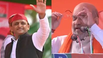 up election 2022-amit shah said akhilesh yadav wears a specs through which he sees caste from one glass and religion-from-other-glass UP Election 2022: অখিলেশকে নিশানা করতে চোখ থেকে চশমা খুললেন অমিত শাহ, বললেন কী?