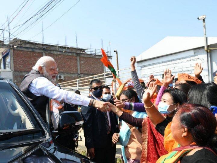 PM Modi greeted and met BJP supporters in Manipur. At the rally, Modi said that every seven out of 10 Manipuri are now benefiting from free ration.  He said that Manipuri women had led a historic battle against foreign forces. Only the NDA government understood their problems and worked towards making their lives better, Modi said. (Photo: Twitter/@ANI)