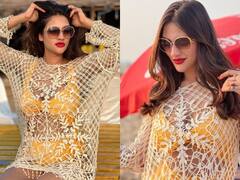 ट्रांसपेरेंट श्रग में नुसरत जहां ने फ्लॉन्ट की बिकिनी, लोग बोले-'जादू है ये कोई या ख़ुदा की माया है'