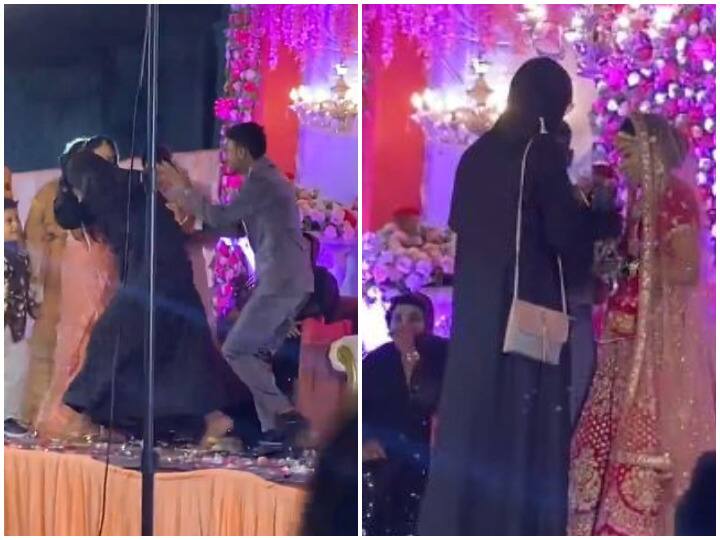 man in burkha teasing bride burkha prank friend groom started beating burkha man on stage Watch: बुर्खा पहन कर दुल्हन के साथ ऐसी हरकते करने लगा शख्स, दूल्हे ने कर दिया पीटना शुरू