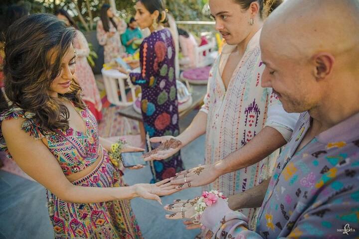 Shibani looked gorgeous in a multicoloured boho-chic blouse and sharara ensemble with matching flower accessories.