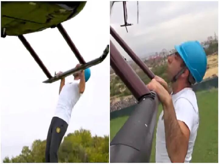 Video of Armenian man doing pull ups in helicopter bar and doing Guinness World record goes viral in social media Watch Video: பறந்து கொண்டே புல் அப்ஸ்! ஹெலிகாப்டரில் தொங்கியபடி சாகசம் - கின்னஸ் சாதனை!