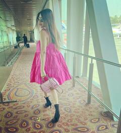 TV Diva Nia Sharma Aces Airport Look In Short Pink Dress & Black Boots- See Pics