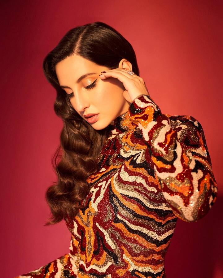 अब बेहतरीन डांसर बन चुकीं नोरा एक्टिंग में भी हाथ आज़मा चुकी हैं वो भुज द प्राइड ऑफ इंडिया में जबरदस्त एक्शन करती दिखीं. नोरा को खासतौर से एक्शन फिल्मों का शौक है. (फोटो – सोशल मीडिया)