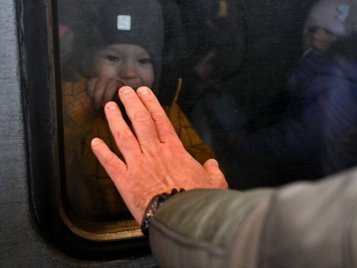 Post the Russian invasion, the Ukrainian government mandated its male citizens between 18-60 years of age to assist the country while their families were evacuated. A man reacts in front of an evacuation train at Kyiv train station on March 5, 2022. US Secretary of State Antony Blinken warns that the war in Ukraine 
