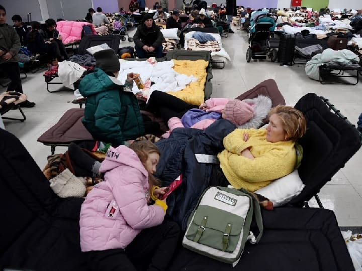 Refugees who have not been able to leave the country as yet are waiting for aid to be able to leave the country safely as the Russian aggression amplifies by the day. People rest at a refugee reception center at the Ukrainian-Polish border crossing in Korczowa on March 5, 2022. US Secretary of State Antony Blinken travels to Poland, Moldova, Latvia, Lithuania, and Estonia from March 3 to 8 to reassure them of US support amid Russia's invasion of Ukraine. (AFP)