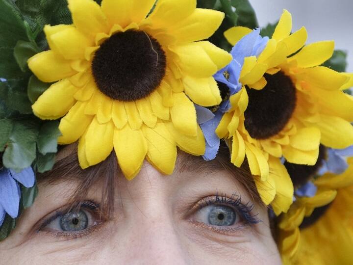 Just like any other walk of life, women stand strong giving out a clear message of their support for Ukraine.  A demonstrator wears blue and yellow flowers during a rally in support of Ukraine in Los Angeles, California, on March 5. (AFP)