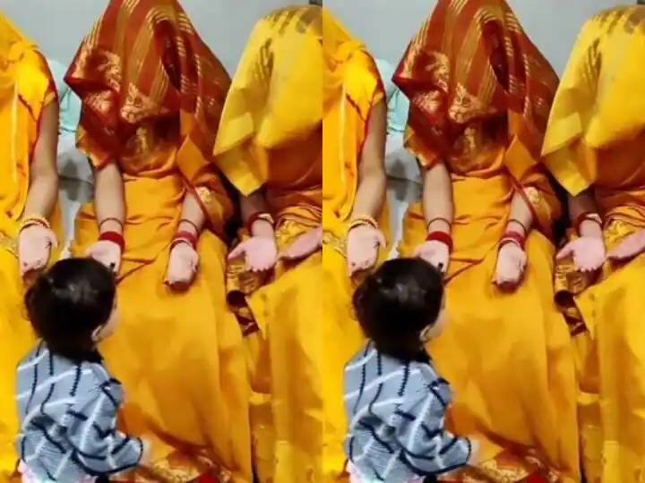 Mother hide with other women’s who wore the same saree  and trick little baby video goes viral Viral Video : एकसारखी साडी नेसलेल्या अनेक महिला, तरी चिमुकल्याने अचूक शोधलं आपल्याच आईला! पाहा व्हिडीओ