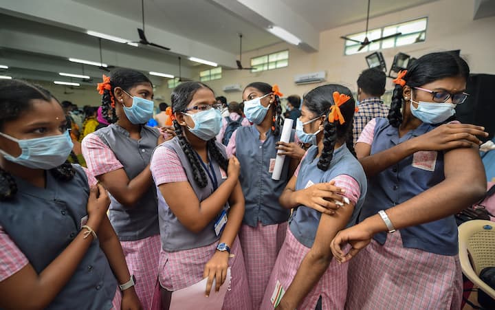 Students interact with each other after receiving a dose of Covid-19 vaccine in Chennai. On the occasion, Prime Minister Narendra Modi said the country is in a much better position to fight the Covid pandemic but people must keep following all precautions. (Image: PTI)