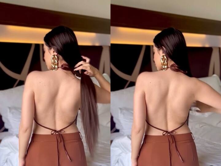 Urfi Javed flaunts her new style in latest video bigg boss ott fame actress urfi बैकलेस टॉप में जुल्फें संवारती इस एक्ट्रेस को आपने पहचाना क्या ? अपने फैशन सेंस के लिए हैं मशहूर