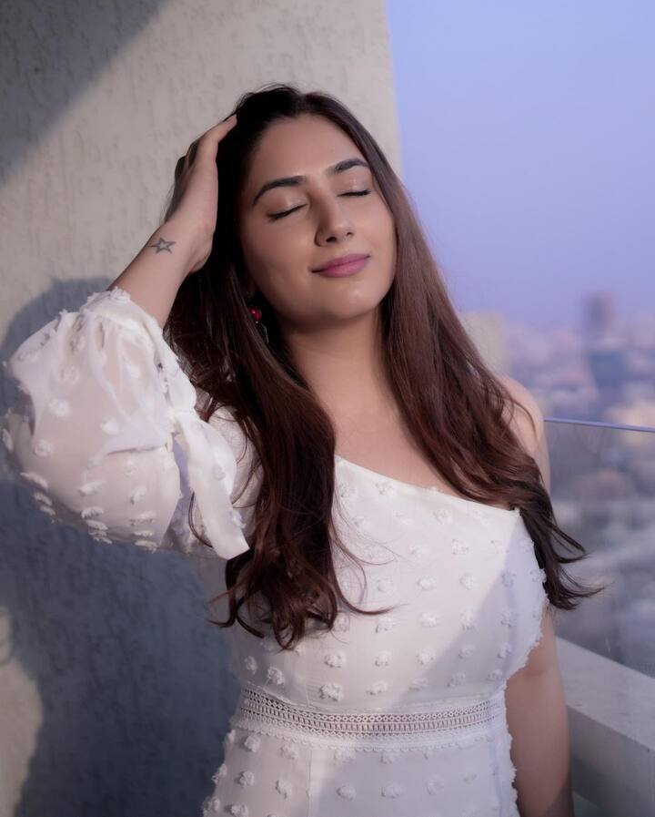 Television actress Disha Parmar looks absolutely gorgeous in the recent pictures that she dropped on Instagram. Dressed in a pretty off-shoulder white dress, she looks beautiful as ever. (Image Courtesy: @dishaparmar/Instagram).