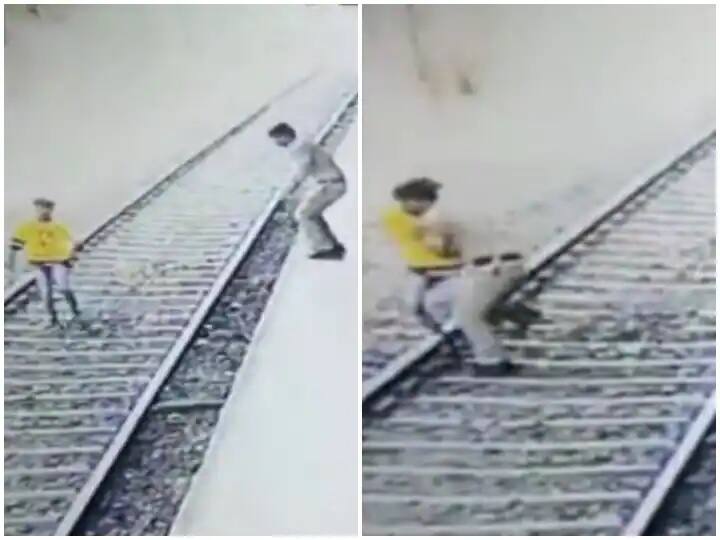 young boy jumped in front of speeding train in thane railway station rpf constable saved his life by risking Video: ટ્રેનની સામે કૂદી જઈ આત્મહત્યાનો પ્રયાસ કરનાર યુવકને પોલીસ જવાને બચાવ્યો, જુઓ વીડિયો