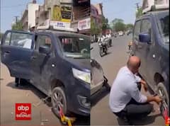 Rajkot : કારચાલકે ટ્રાફિકના લોકવાળું કારનું ટાયર જ કાઢી નાખ્યું, જુઓ વિડીયો