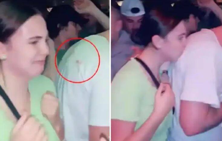 Mystery girl dubbed the 'lipstick bandit' is filmed planting kisses on unsuspecting men's t-shirts, Watch Video Trending: ਲੜਕੀ ਨੇ ਅਣਪਛਾਤੇ ਵਿਅਕਤੀ ਦੀ ਪਿੱਠ 'ਤੇ ਕੀਤੀ Kiss, ਫਿਰ ਹੋਇਆ ਅਜਿਹਾ ਸਭ ਹੋ ਗਏ ਹੈਰਾਨ